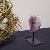 Amethyst Geode Cluster on a Black Stand